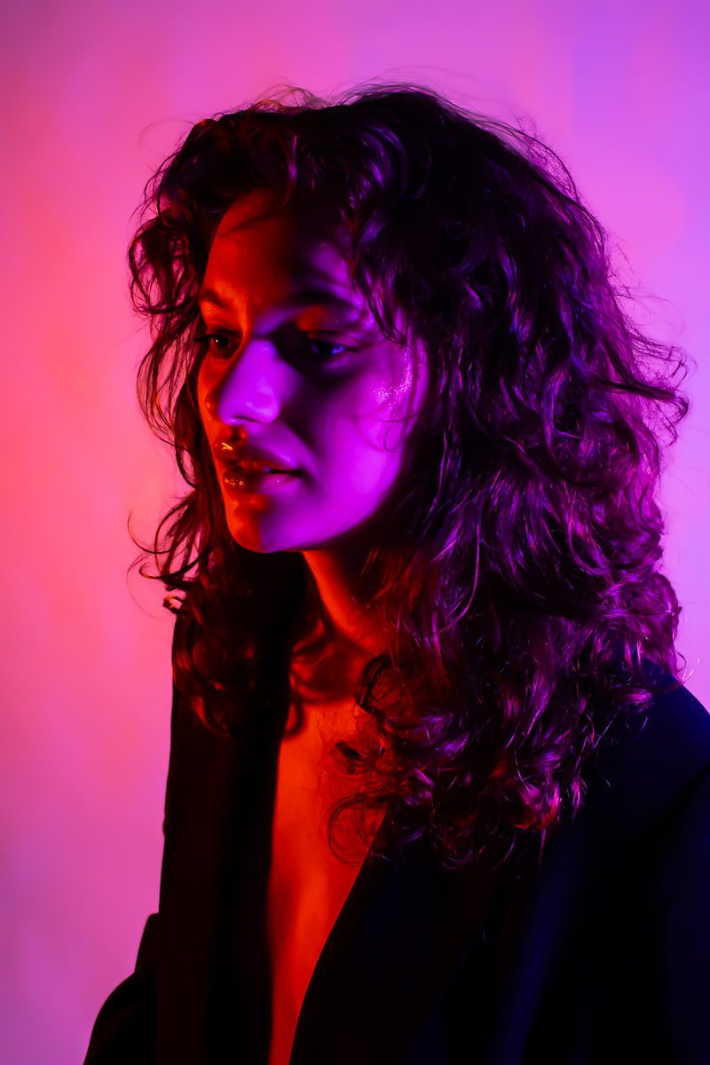 Portrait photo with red and pink lighting