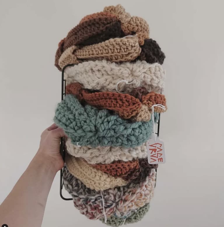 A stack of different colored knit toques